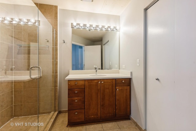 1600 S Indiana Ave Unit 508, Chicago, IL 60616 - bathroom with a shower stall, vanity, and tile patterned floors
