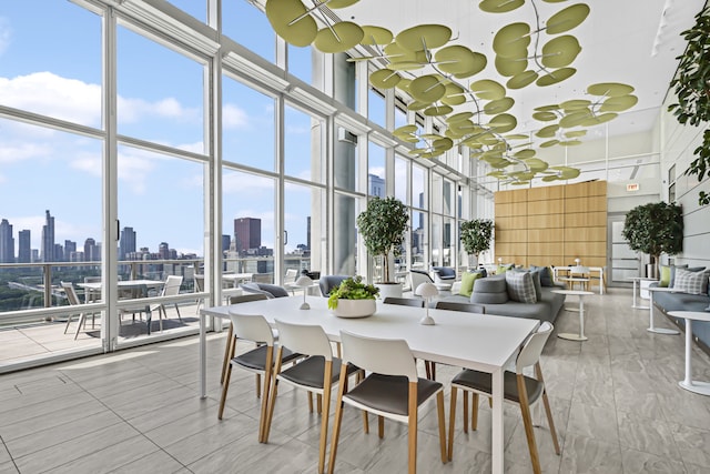 340 E Randolph St Unit 404, Chicago, IL 60601 - dining area with a high ceiling, floor to ceiling windows, and a view of skyline