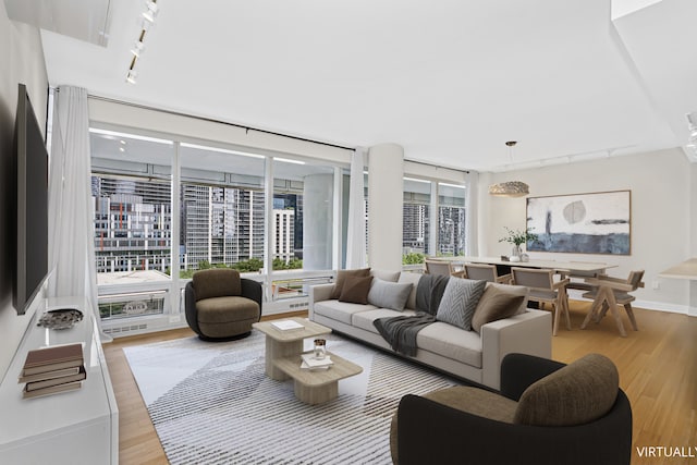 340 E Randolph St Unit 404, Chicago, IL 60601 - living area featuring rail lighting and light wood finished floors