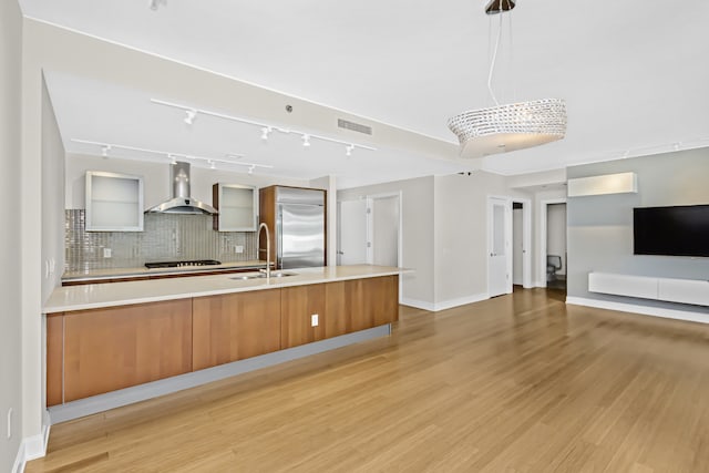 340 E Randolph St Unit 404, Chicago, IL 60601 - kitchen with wall chimney range hood, modern cabinets, high end fridge, and tasteful backsplash