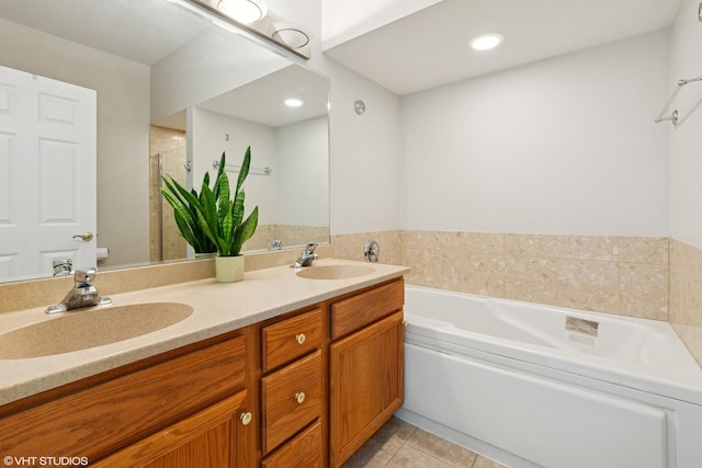 5414 S Greenwood Ave Unit 2, Chicago, IL 60615 - bathroom featuring a bath, double vanity, tile patterned floors, a shower with shower door, and recessed lighting