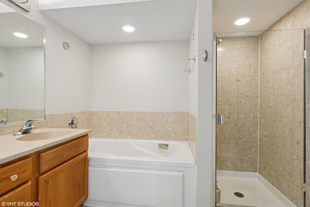 5414 S Greenwood Ave Unit 2, Chicago, IL 60615 - bathroom featuring a stall shower, vanity, a bath, and recessed lighting