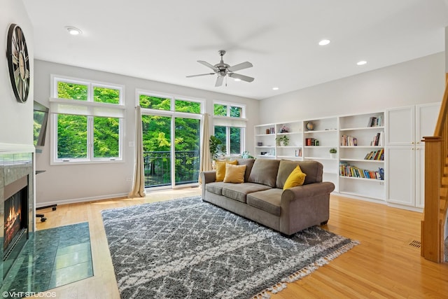 5414 S Greenwood Ave Unit 2, Chicago, IL 60615 - living area with ceiling fan, healthy amount of natural light, a tiled fireplace, light wood-style flooring, and recessed lighting
