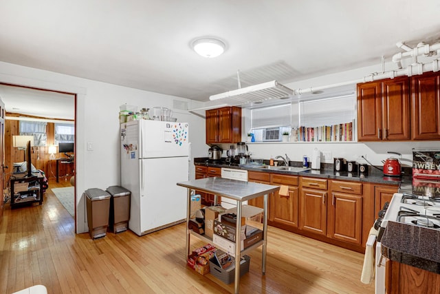 109 S Maple Ave, Oak Park, IL 60302 - kitchen featuring white appliances, light wood-style flooring, and dark countertops