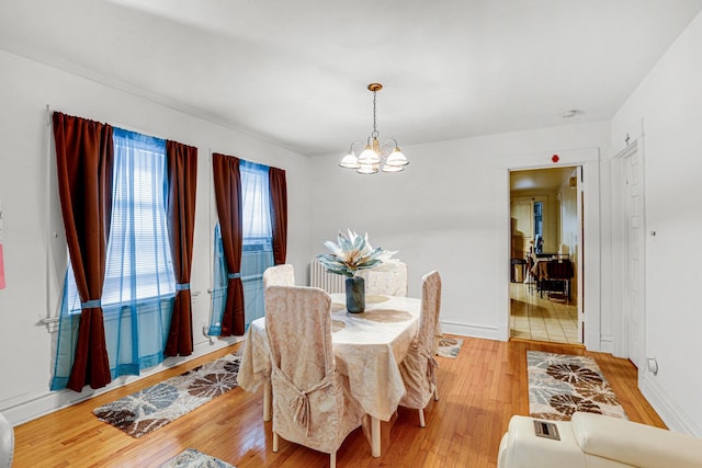 109 S Maple Ave, Oak Park, IL 60302 - dining space featuring a chandelier and light wood finished floors