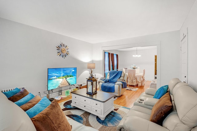 109 S Maple Ave, Oak Park, IL 60302 - living room featuring a chandelier and light wood finished floors