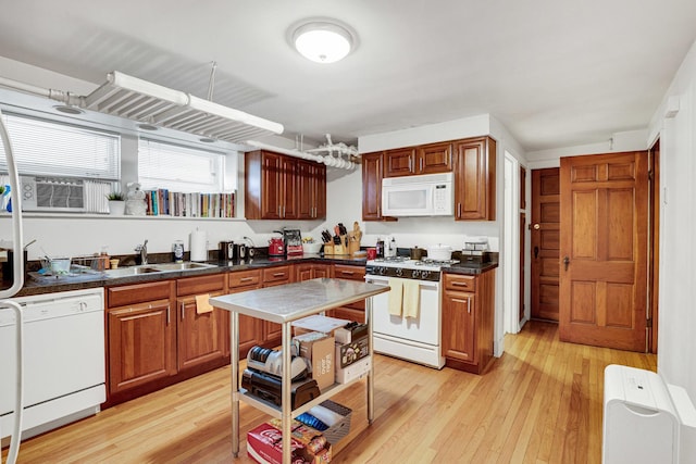 109 S Maple Ave, Oak Park, IL 60302 - kitchen with white appliances, light wood finished floors, dark countertops, and cooling unit