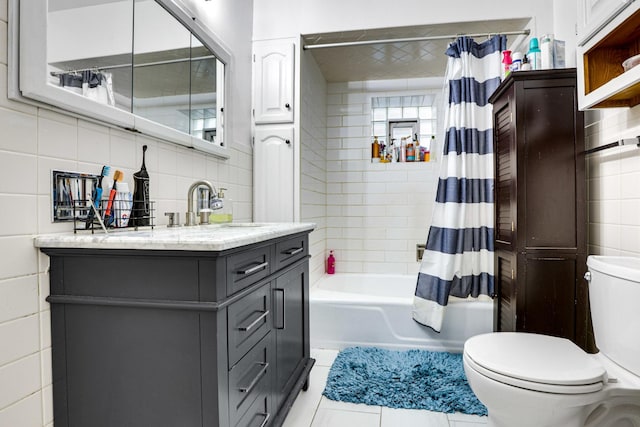 109 S Maple Ave, Oak Park, IL 60302 - full bath with tile walls, vanity, shower / bath combo, and tile patterned floors