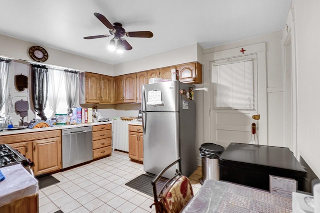 109 S Maple Ave, Oak Park, IL 60302 - kitchen with appliances with stainless steel finishes, light countertops, a ceiling fan, and light tile patterned floors