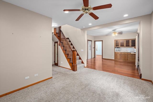 92 Maple St, Sugar Grove, IL 60554 - unfurnished living room featuring carpet flooring, a ceiling fan, stairs, recessed lighting, and baseboard heating