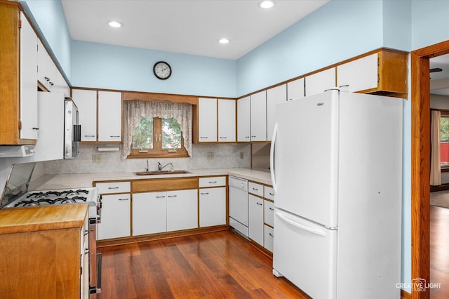 92 Maple St, Sugar Grove, IL 60554 - kitchen featuring white appliances, healthy amount of natural light, dark wood finished floors, backsplash, and recessed lighting