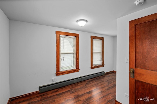 92 Maple St, Sugar Grove, IL 60554 - unfurnished room with a baseboard heating unit, dark wood-style flooring, and a smoke detector