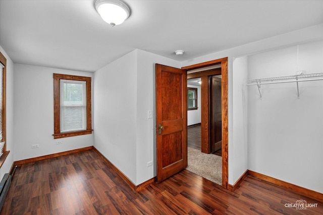 92 Maple St, Sugar Grove, IL 60554 - unfurnished bedroom featuring a closet and dark wood-style floors