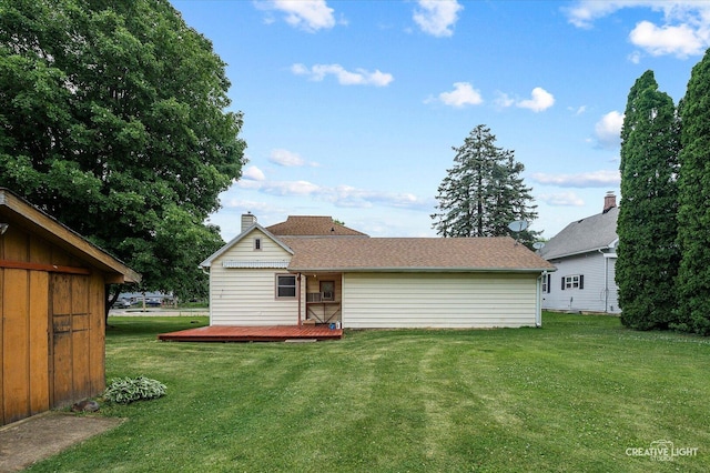 92 Maple St, Sugar Grove, IL 60554 - back of property featuring a deck, a yard, and a chimney