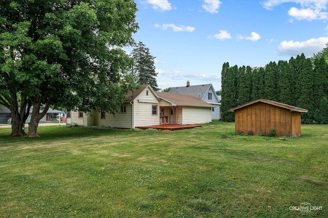 92 Maple St, Sugar Grove, IL 60554 - view of grassy yard featuring a wooden deck and a storage shed
