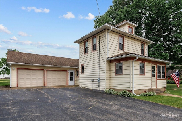 92 Maple St, Sugar Grove, IL 60554 - view of home's exterior featuring driveway and an attached garage