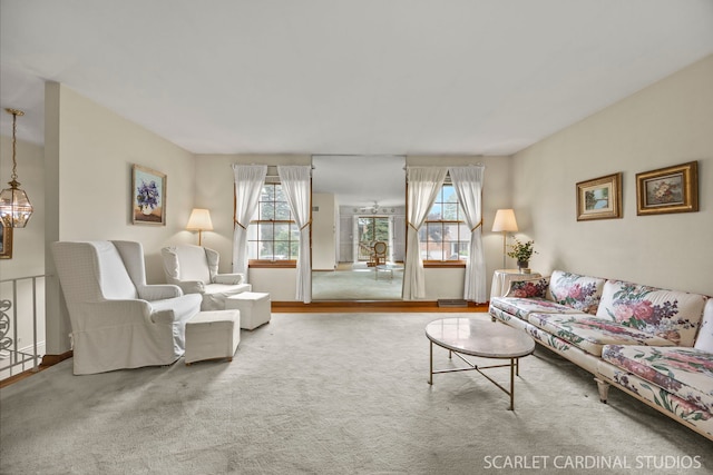 718 Liberty Ln, Lombard, IL 60148 - carpeted living area with plenty of natural light and a chandelier