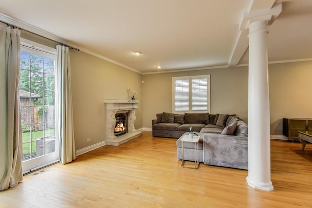 1206 Lathrop Ave, River Forest, IL 60305 - living area with decorative columns, ornamental molding, light wood-style floors, and a high end fireplace