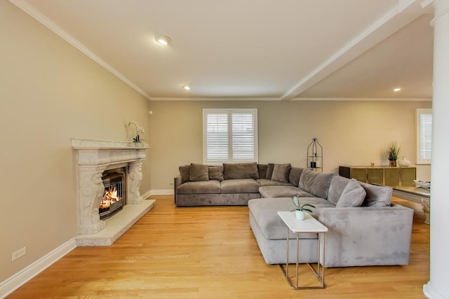 1206 Lathrop Ave, River Forest, IL 60305 - living area featuring healthy amount of natural light, recessed lighting, a premium fireplace, light wood-type flooring, and ornamental molding