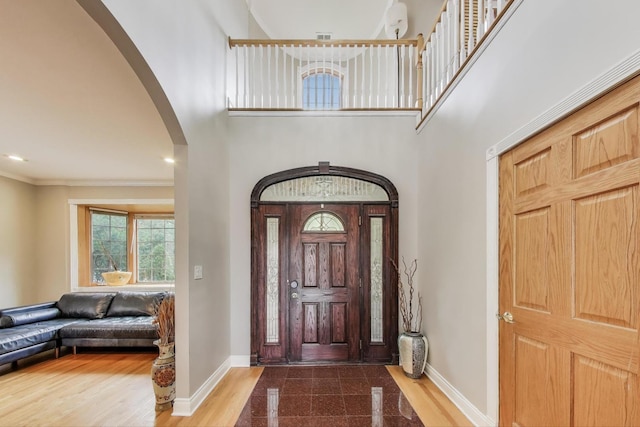 1206 Lathrop Ave, River Forest, IL 60305 - foyer entrance featuring arched walkways, a high ceiling, and crown molding