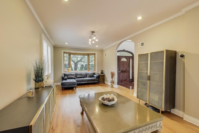 1206 Lathrop Ave, River Forest, IL 60305 - living room featuring arched walkways, light wood-type flooring, ornamental molding, and recessed lighting