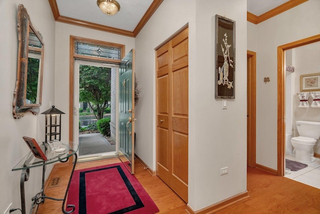 20910 W Blossom Ln, Plainfield, IL 60544 - entryway with light wood-type flooring and ornamental molding