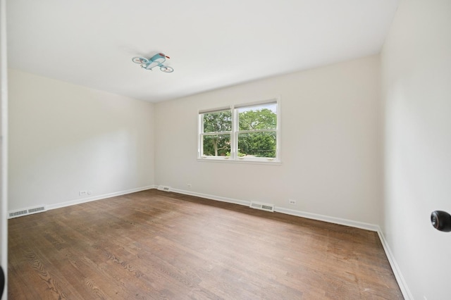 2416 Birchwood Ln, Wilmette, IL 60091 - empty room with wood finished floors
