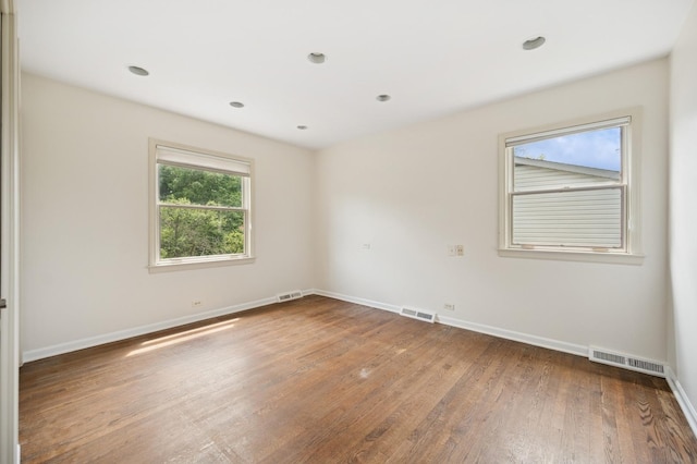 2416 Birchwood Ln, Wilmette, IL 60091 - unfurnished room with wood finished floors and recessed lighting