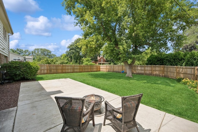 2416 Birchwood Ln, Wilmette, IL 60091 - fenced backyard featuring an outdoor fire pit and a patio