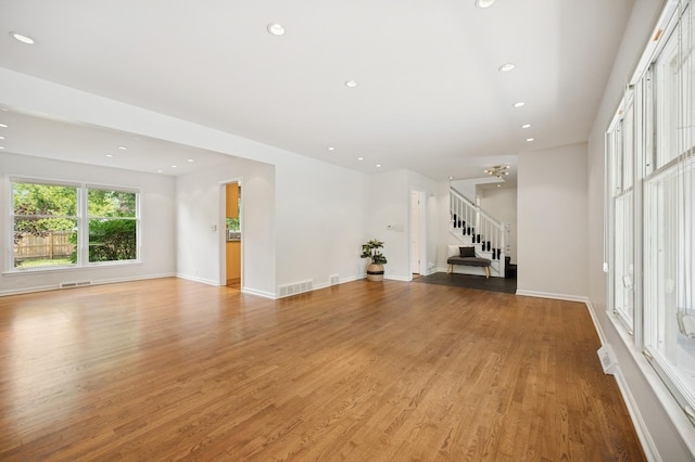 2416 Birchwood Ln, Wilmette, IL 60091 - unfurnished living room featuring stairs, light wood-type flooring, and recessed lighting