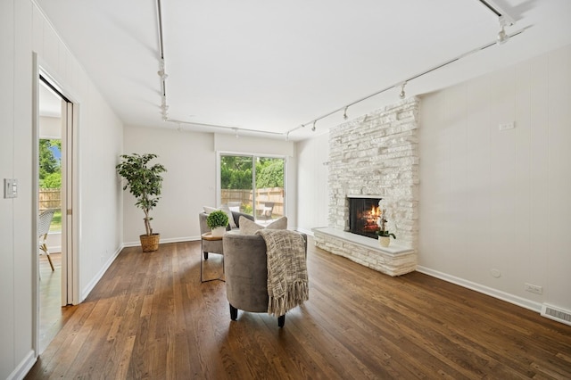 2416 Birchwood Ln, Wilmette, IL 60091 - living area featuring track lighting, hardwood / wood-style floors, and a stone fireplace