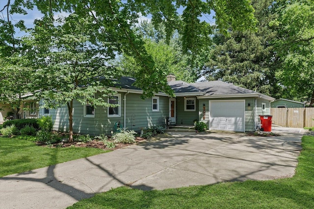 1704 Chevy Chase Dr, Champaign, IL 61821 - view of front facade featuring an attached garage, driveway, and a chimney