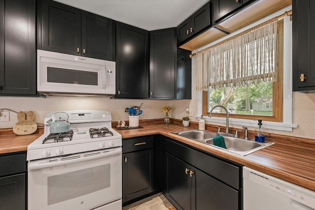 1704 Chevy Chase Dr, Champaign, IL 61821 - kitchen with white appliances, dark cabinetry, and wood counters