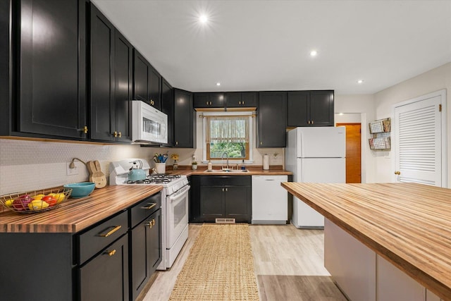 1704 Chevy Chase Dr, Champaign, IL 61821 - kitchen featuring white appliances, butcher block countertops, dark cabinets, and recessed lighting