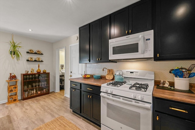 1704 Chevy Chase Dr, Champaign, IL 61821 - kitchen with white appliances, dark cabinets, wood counters, and decorative backsplash