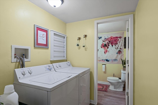 1704 Chevy Chase Dr, Champaign, IL 61821 - laundry room with washing machine and clothes dryer and wood finished floors