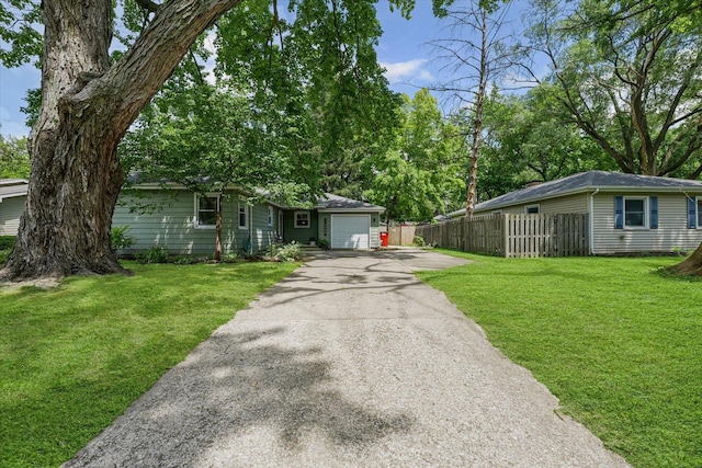 1704 Chevy Chase Dr, Champaign, IL 61821 - view of front of house with asphalt driveway and an attached garage