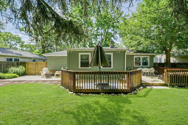 1704 Chevy Chase Dr, Champaign, IL 61821 - back of house with a wooden deck, a patio area, and a chimney