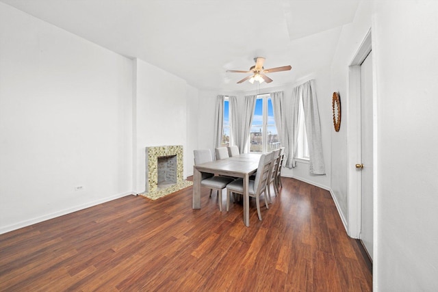 5522 S Wells St, Chicago, IL 60621 - dining room featuring a ceiling fan, wood finished floors, and a tiled fireplace