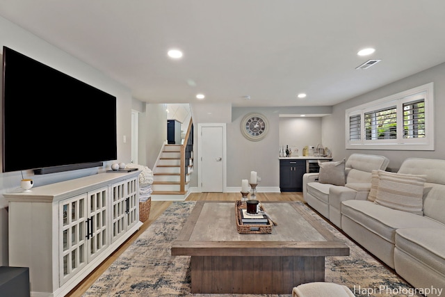 813 E Gardenia Ln, Palatine, IL 60074 - living area featuring light wood finished floors, stairs, bar, and recessed lighting