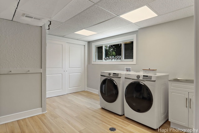 813 E Gardenia Ln, Palatine, IL 60074 - laundry area with washer and clothes dryer, cabinet space, and light wood finished floors
