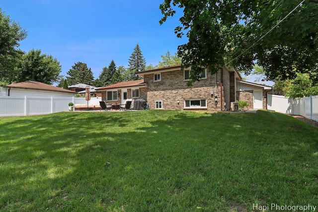 813 E Gardenia Ln, Palatine, IL 60074 - back of house with a fenced backyard, a patio area, and brick siding