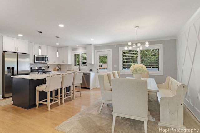 813 E Gardenia Ln, Palatine, IL 60074 - dining space featuring light wood-style flooring, a chandelier, crown molding, and recessed lighting