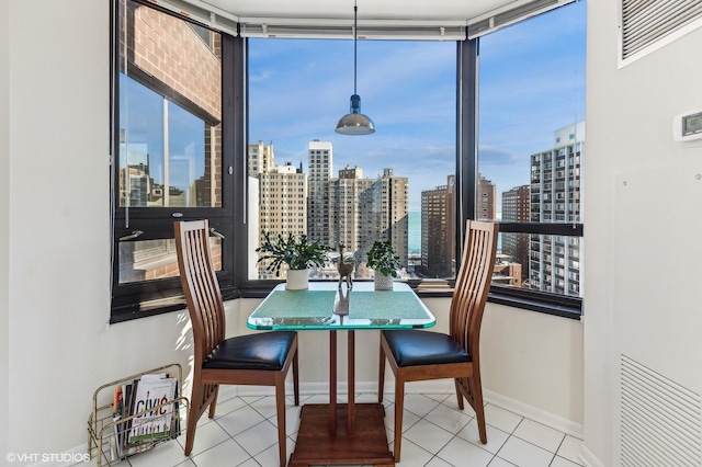 1410 N State Pkwy Unit 18B, Chicago, IL 60610 - tiled dining area featuring a view of skyline and baseboards