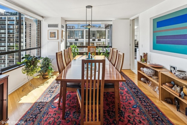 1410 N State Pkwy Unit 18B, Chicago, IL 60610 - dining room featuring wood finished floors