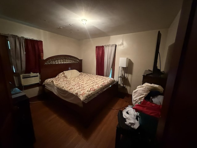507 W 12th St, Sterling, IL 61081 - bedroom featuring dark wood-type flooring and a wall unit AC