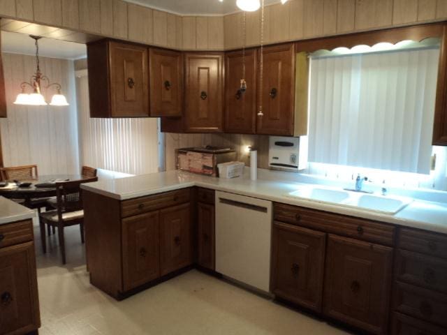 7341 W 56th Pl, Summit, IL 60501 - kitchen with dishwasher, light countertops, a chandelier, hanging light fixtures, and a peninsula