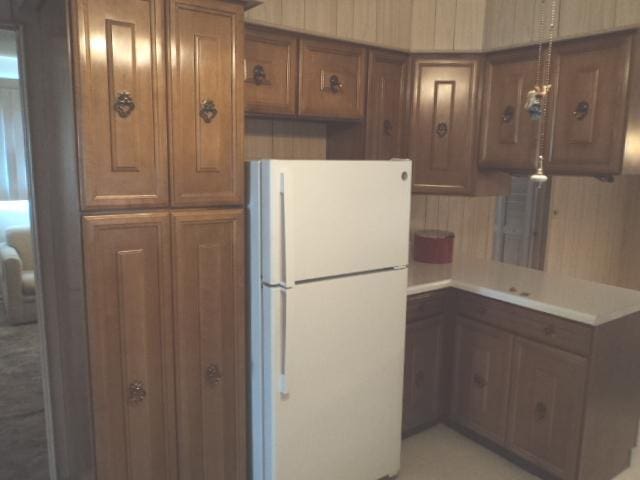 7341 W 56th Pl, Summit, IL 60501 - kitchen featuring freestanding refrigerator, brown cabinets, and light countertops