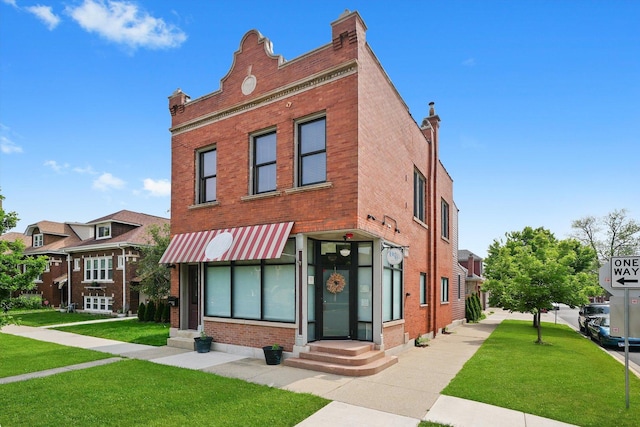 2347 Clarence Ave, Berwyn, IL 60402 - view of front of home featuring brick siding, a front yard, and entry steps
