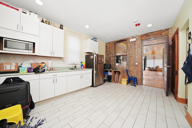 2347 Clarence Ave, Berwyn, IL 60402 - kitchen with stainless steel appliances, light countertops, white cabinets, recessed lighting, and backsplash